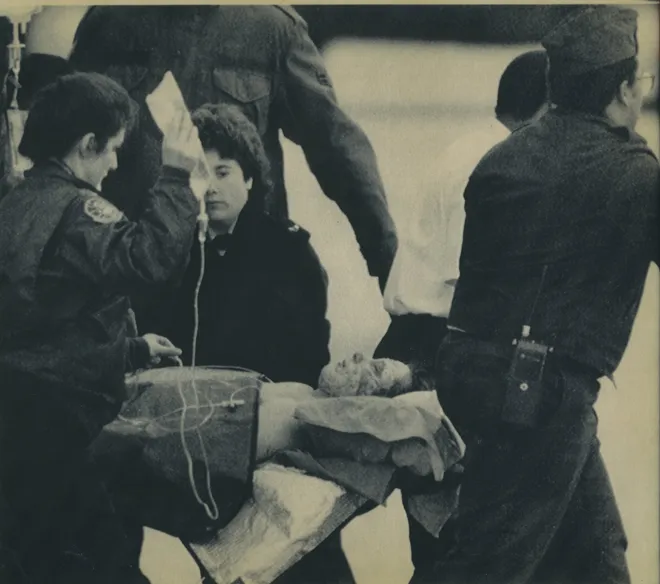 20 May 1987: FC3 Mark Bareford is carried to a waiting plane at Andrews Air Force Base. He was burnt after the missile attack on the 
                            USS Stark and was sent to the Brooke Army Medical Base in Texas.