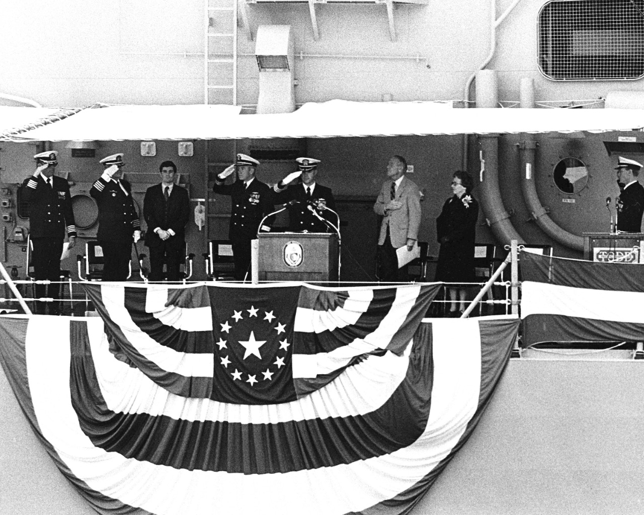 23 October 1982: Distinguished guests standing on the speakers platform during the commissioning ceremony.