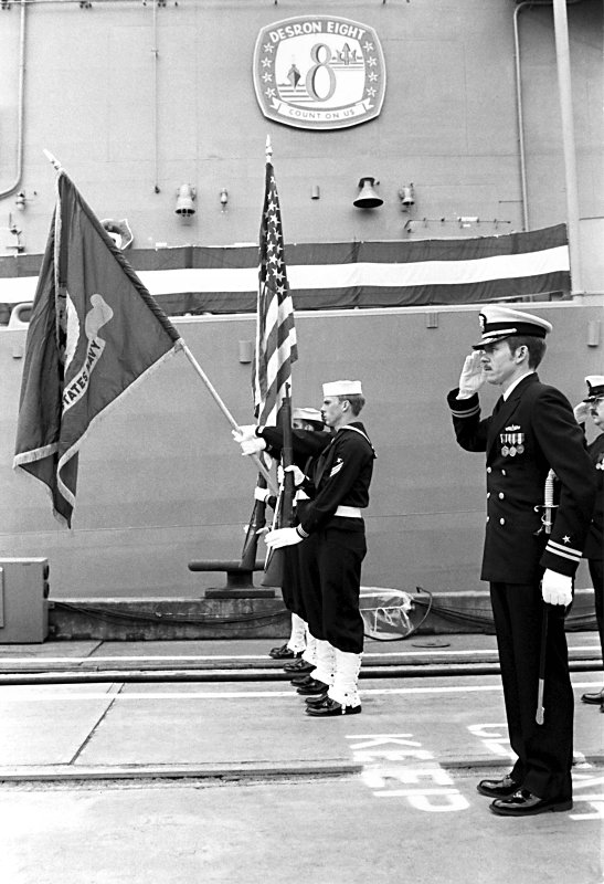 23 October 1982: A crewman raises the ships flag at the commissioning ceremony for the USS Stark FFG-31 
                            at Todd Pacific Shipyards Corp.