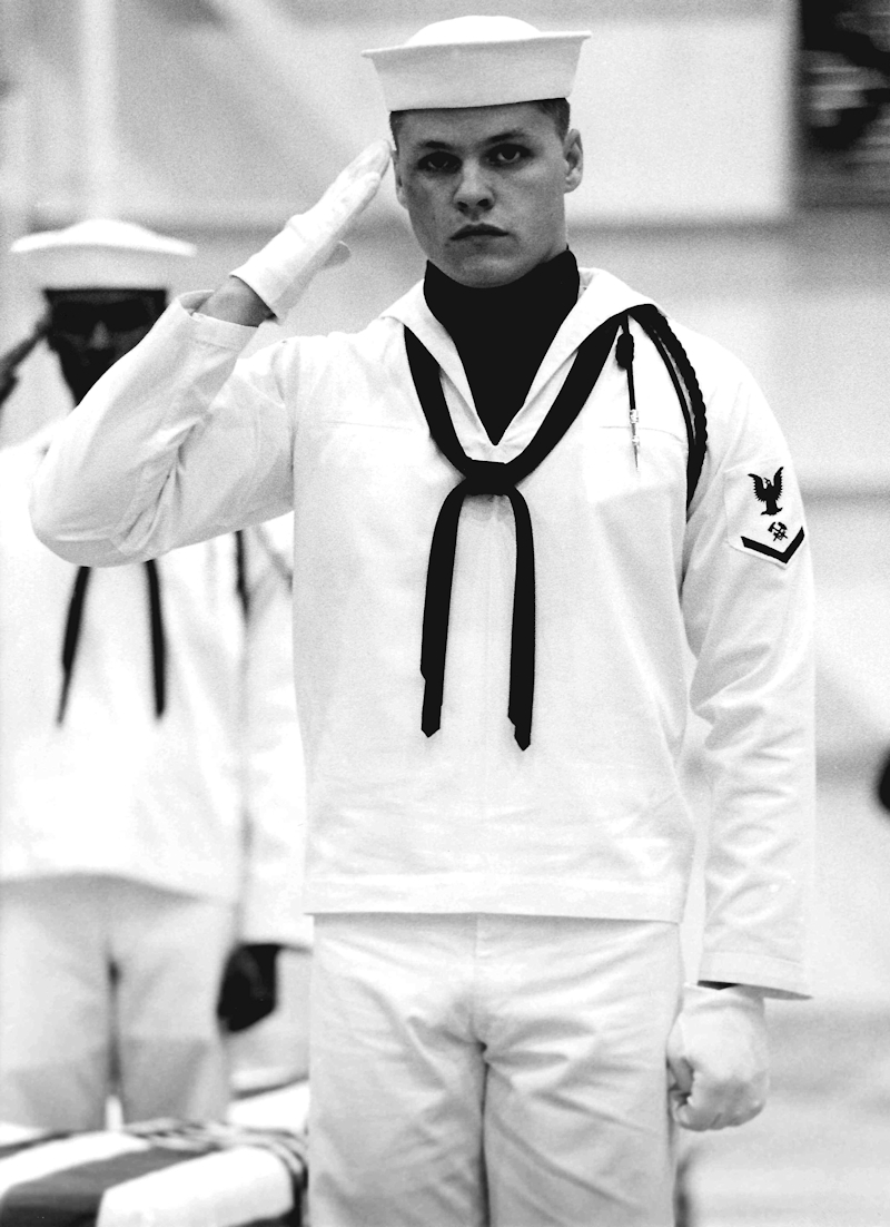 Honor Guard rendering a salute during the ceremony at Dover Air Force Base.