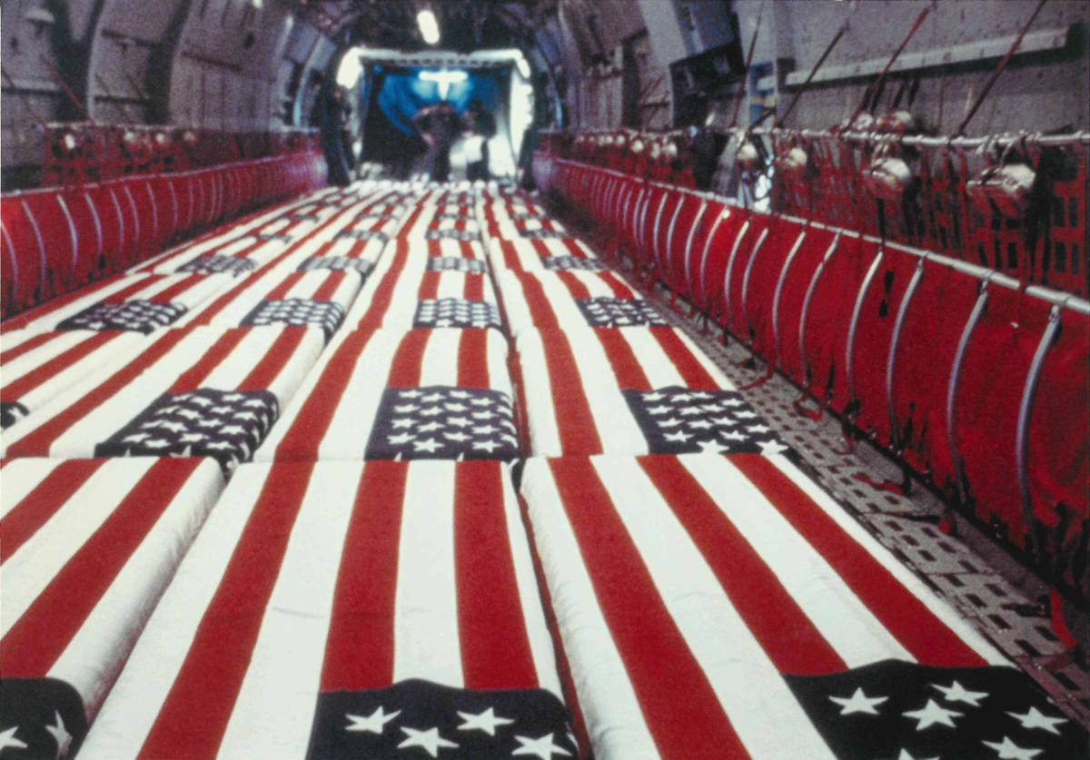 The flag-draped coffins stationed on the C-141 Starlifter before being escorted to Mayport.