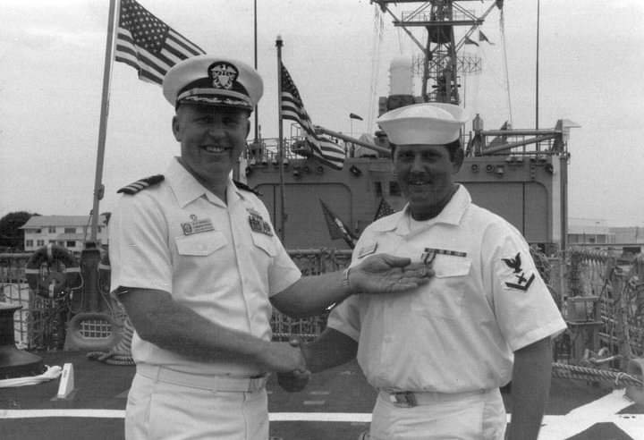 GMM3 Bernard Martin receiving the Humanitarian Medal from Captain Brindel during the MEF Cruise 1984